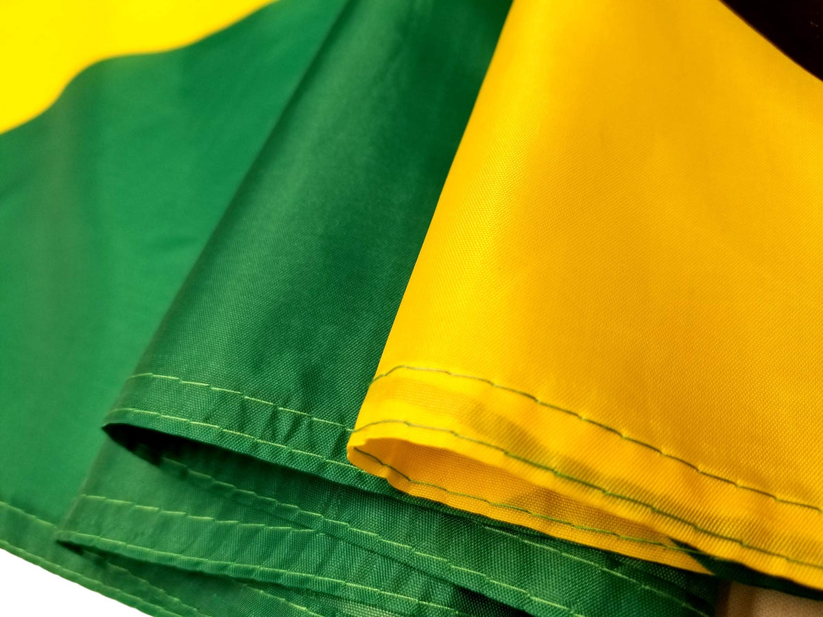 High Supply Jamaican flag close-up of double stitched edges for durability.