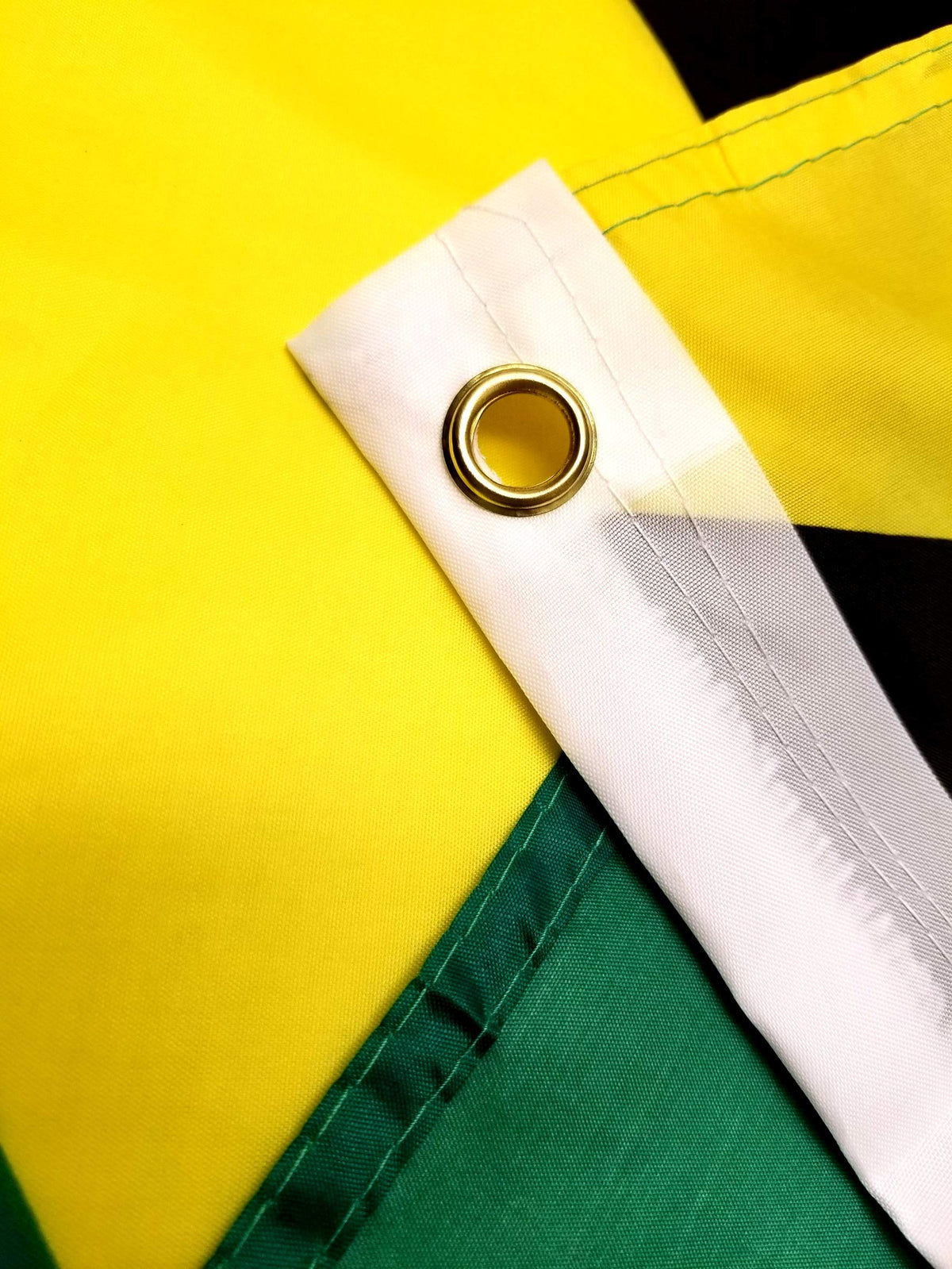 High Supply Jamaican flag displayed on a flagpole for bold visibility.