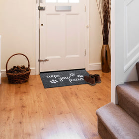 HLFMVWE paws-print textured doormat welcomes guests while hiding wear.