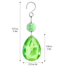 H&D HYALINE & DORA green suncatcher hanging from a curtain or window