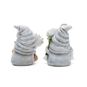 Hodao gnomes holding colorful flowers invite bees and butterflies to your outdoor area.