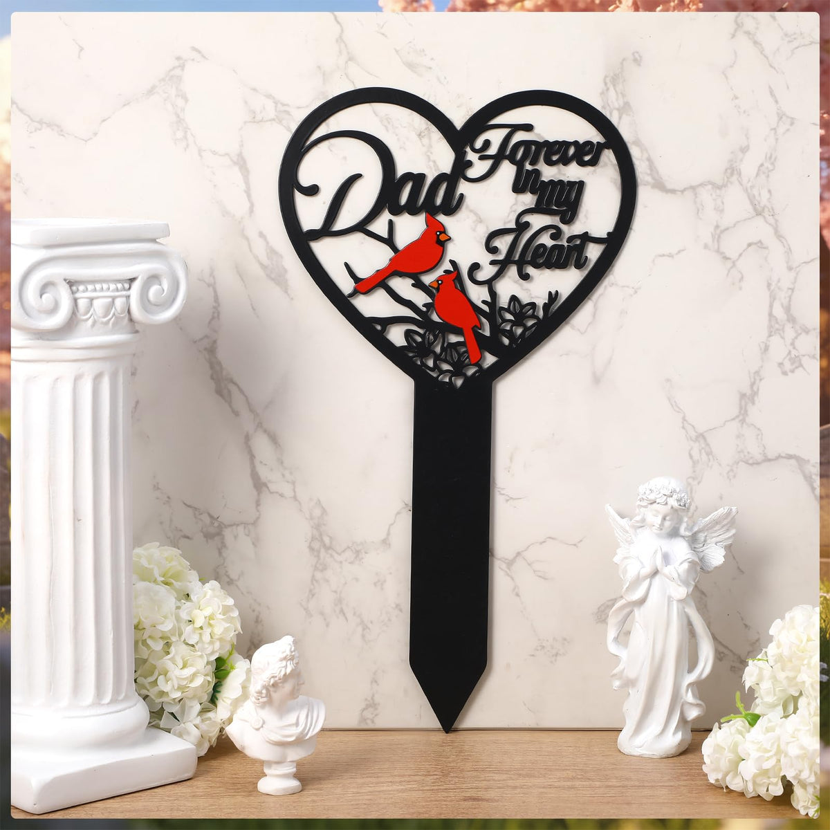 Cardinals and butterflies garden decor enhancing a gentle memorial scene.