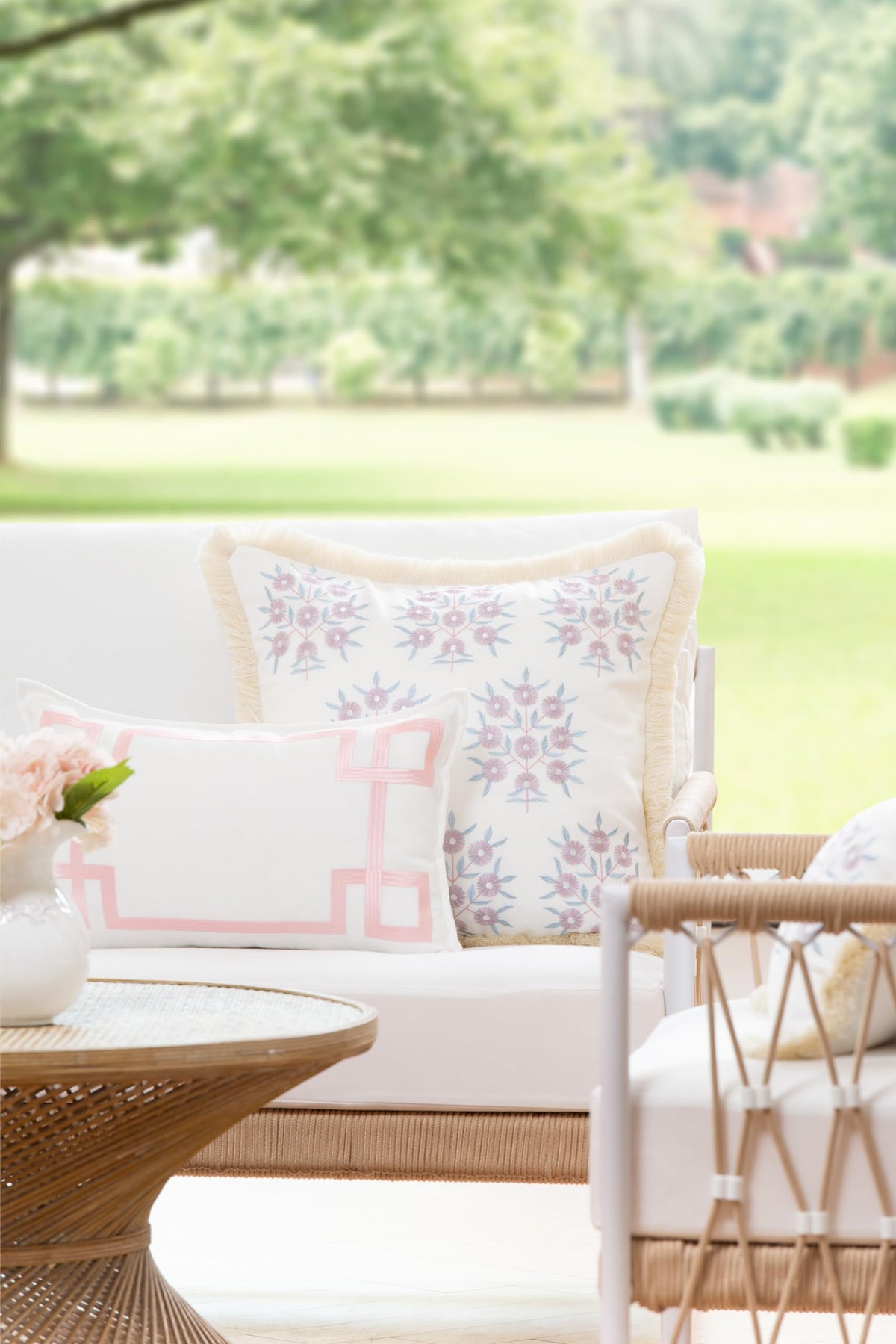 Hofdeco Premium blush pink Greek key embroidery enhances cozy indoor lounges beautifully.