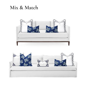 Hofdeco Premium Coastal lumbar pillow cover on an outdoor sofa in shaded area.
