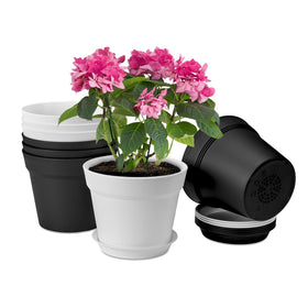 Homenote 7.5-inch plant pots in white and black for indoor display on a windowsill