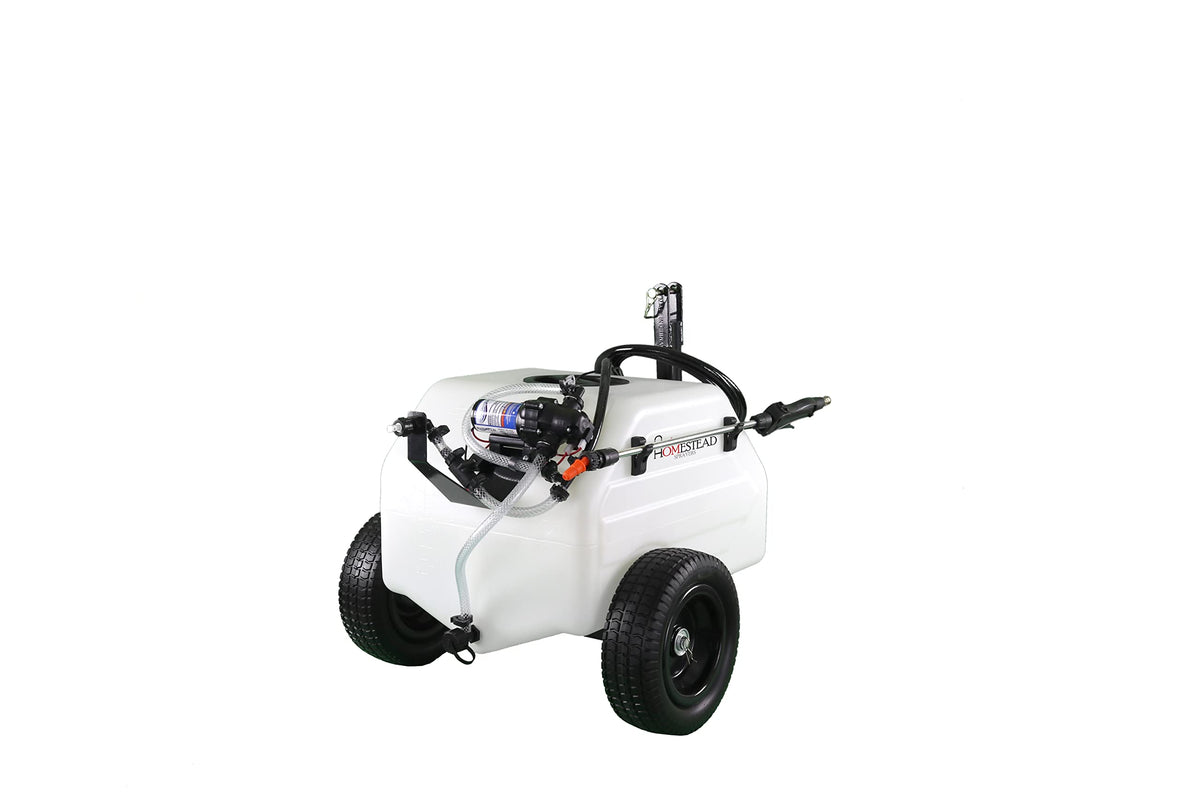 Homestead 12 gallon trailer sprayer ready for field applications behind a mower.