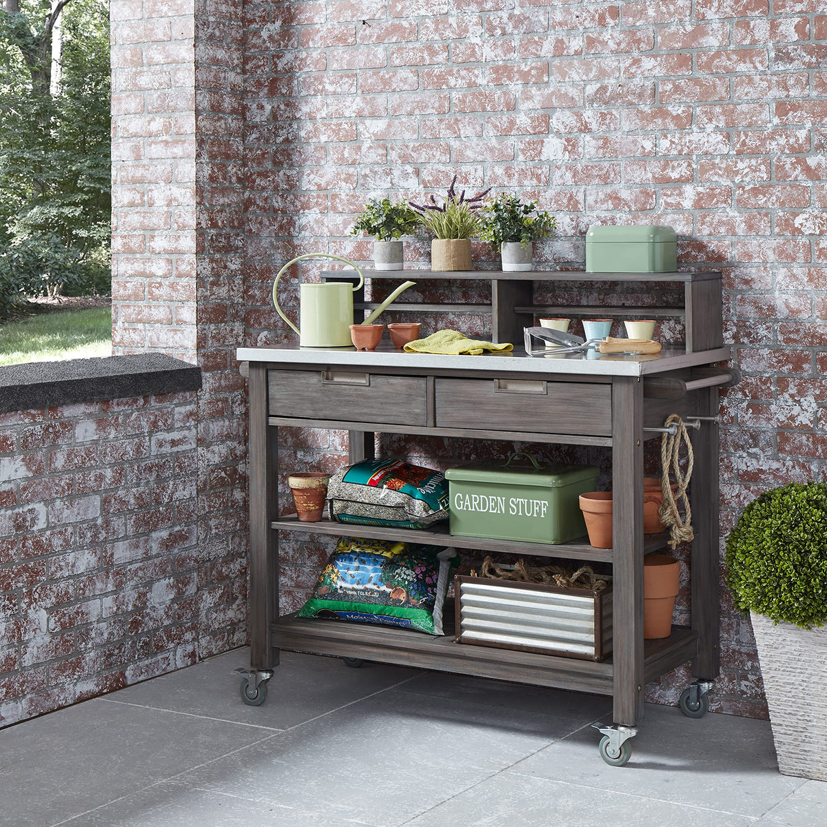 Two drawers and slatted shelves on the Maho bench provide organized tool storage