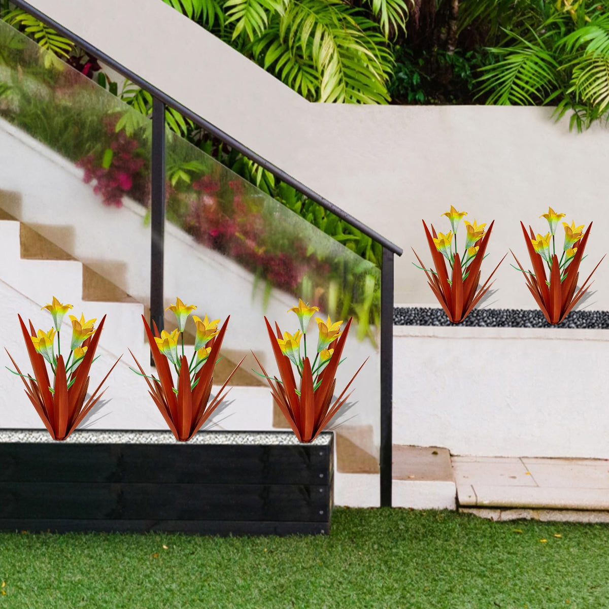 Two big yellow lilies center the Homight agave for focal point.