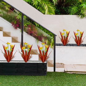Two big yellow lilies center the Homight agave for focal point.
