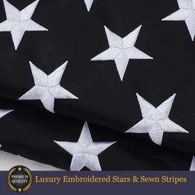 Homissor flag close-up showing reinforced stitching and brass grommets for durability
