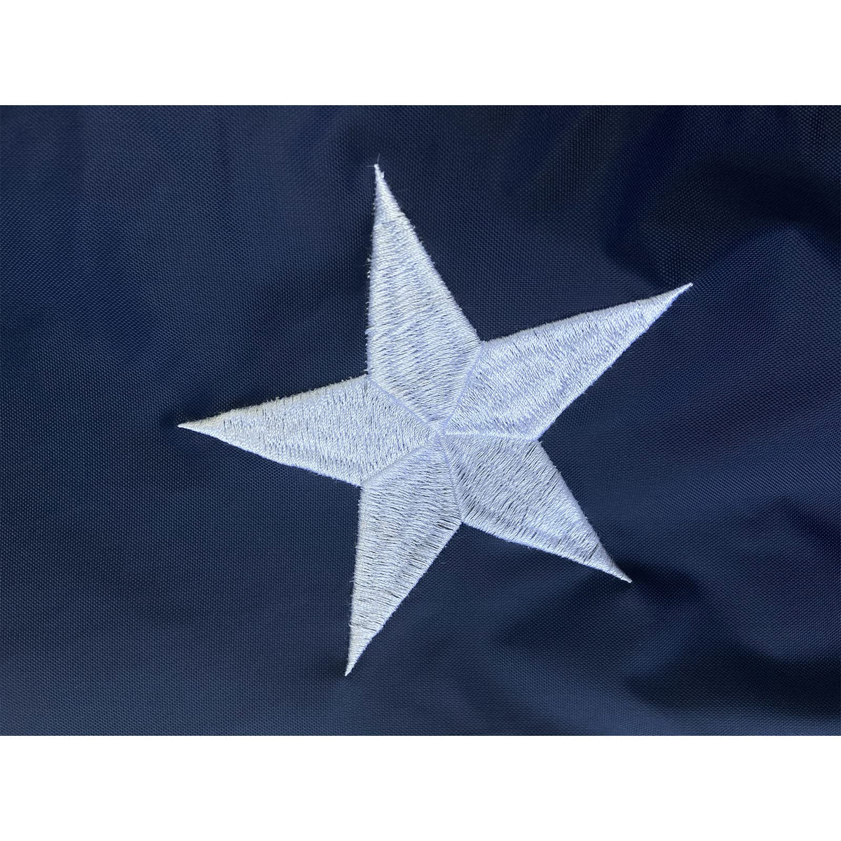 Homissor flag with dual brass grommets for easy hanging.