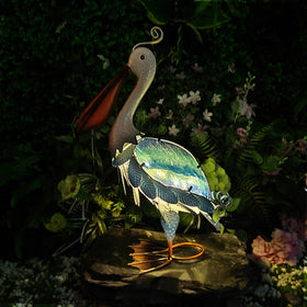 HONGLAND glass-bodied pelican detail highlights crystal clarity in sunlit and moonlit settings.
