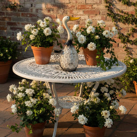 HONGLAND hand-painted goose decoration adds texture and charm to any space.