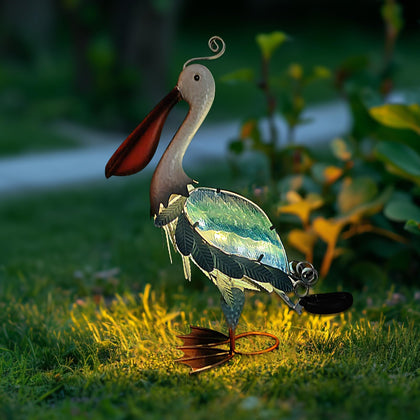 HONGLAND solar pelican statue with glass accents enhances day and night garden appeal.