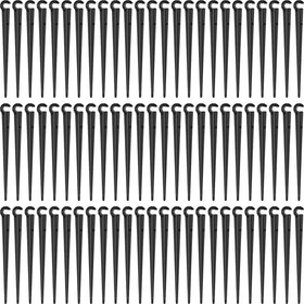 Honoson 240-pack irrigation stake set secures tubing in garden beds.