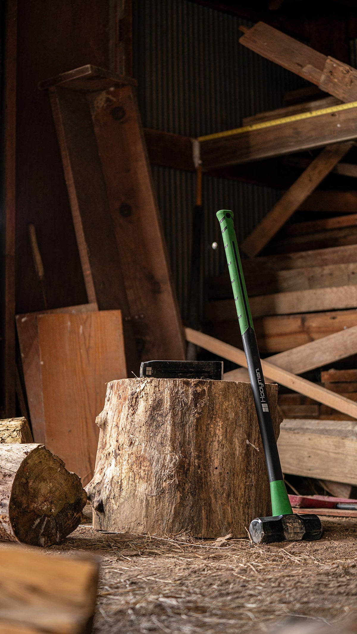 Hooyman Splitting Wedge with hammer demonstrates controlled driving for large logs.