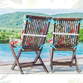 Hoteam flower-pattern cushions on a wicker chair enhance porch seating.