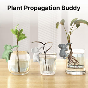 HoWhen Howhen grey elephant figurine hanging on edge adding terrarium appeal.