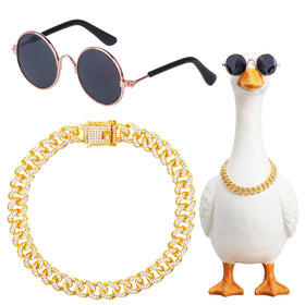 Hoyuwak goose outfit with gold rhinestone collar on a lawn statue, stylish yard decor.