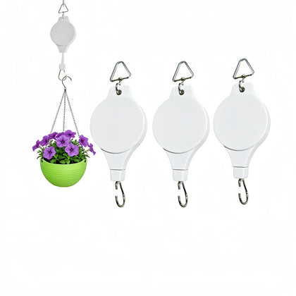 HstBnw retractable plant hanger in use with smooth vertical adjustment for pots.