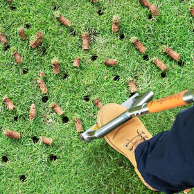 Hugeneroy manual push core aerator side handle reduces fatigue during lawn work.