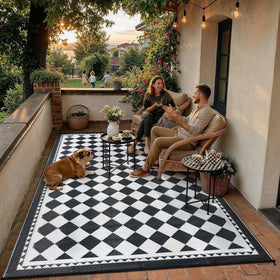HUGEAR Outdoor Rug Waterproof 5x8 on a patio demonstrates weatherproof durability.