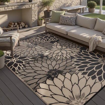 HUGEAR waterproof outdoor rug showing all-weather durability on a patio deck