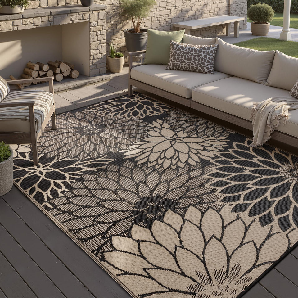 HUGEAR waterproof outdoor rug showing all-weather durability on a patio deck