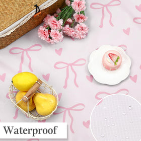 HunnmingRe pink bow blanket ideal for camping or picnics on grass.