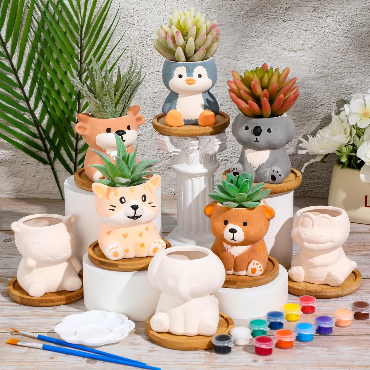 Hushee finished painted animal planters ready for display at home.
