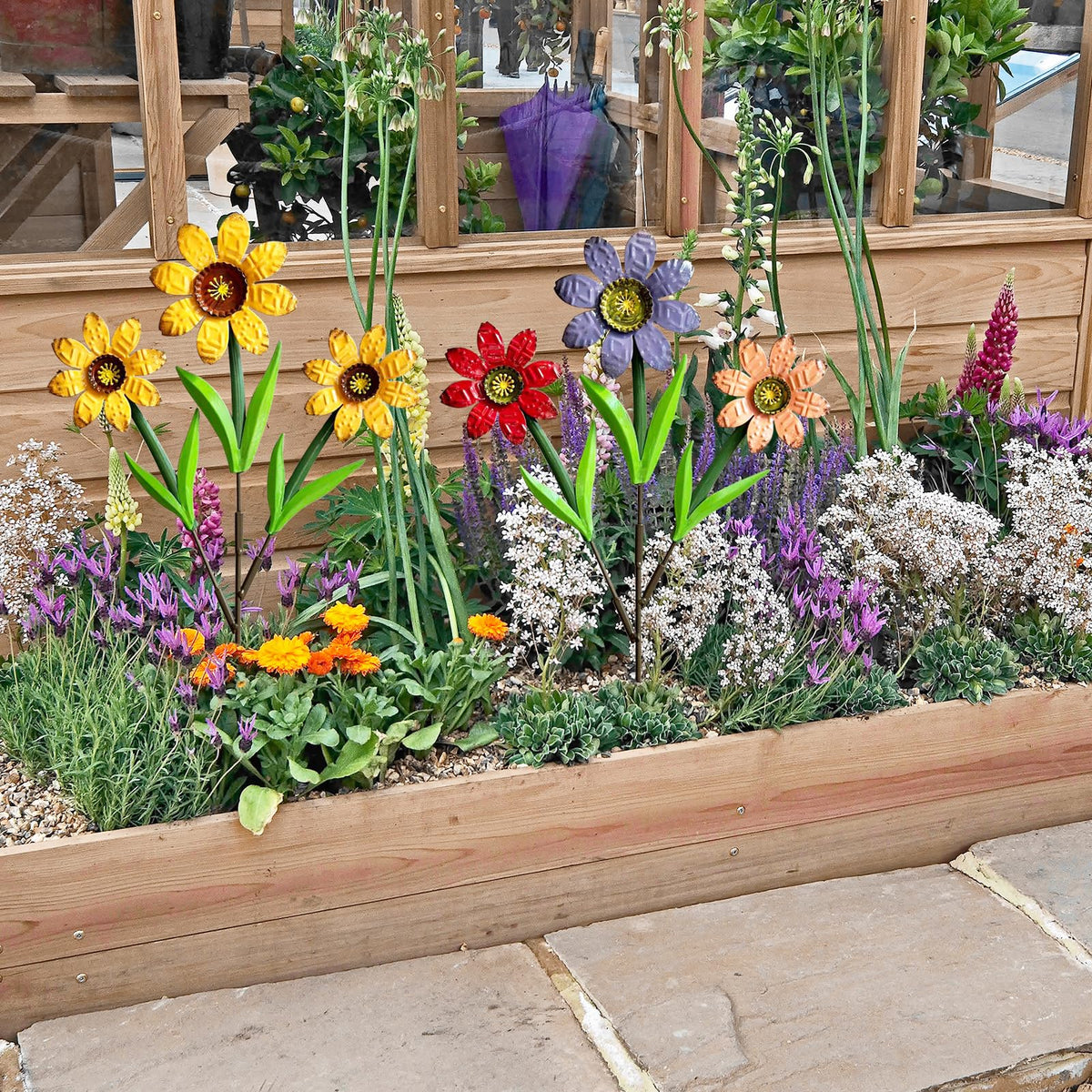 HUTHDAK decorative stake set complements garden borders beautifully.
