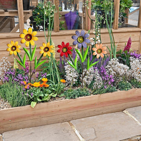 HUTHDAK decorative stake set complements garden borders beautifully.