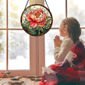 HWRHTR stained glass suncatcher displaying vivid colors in a sunlit room.