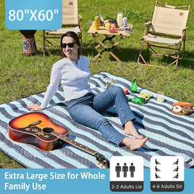 HX&OD Picnic Blanket folded compact, easy to carry with strap.