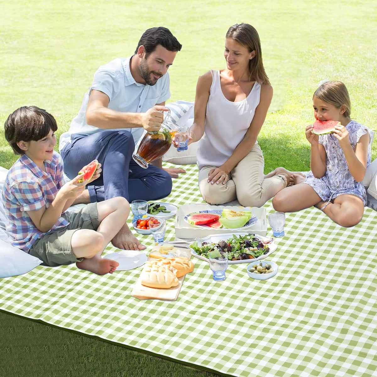 HX&OD picnic blanket on a sunny beach with family