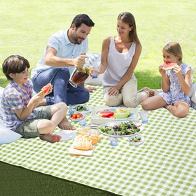 HX&OD picnic blanket on a sunny beach with family