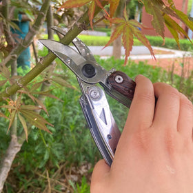 IGRARK folding multitool shears shown in compact carrying position