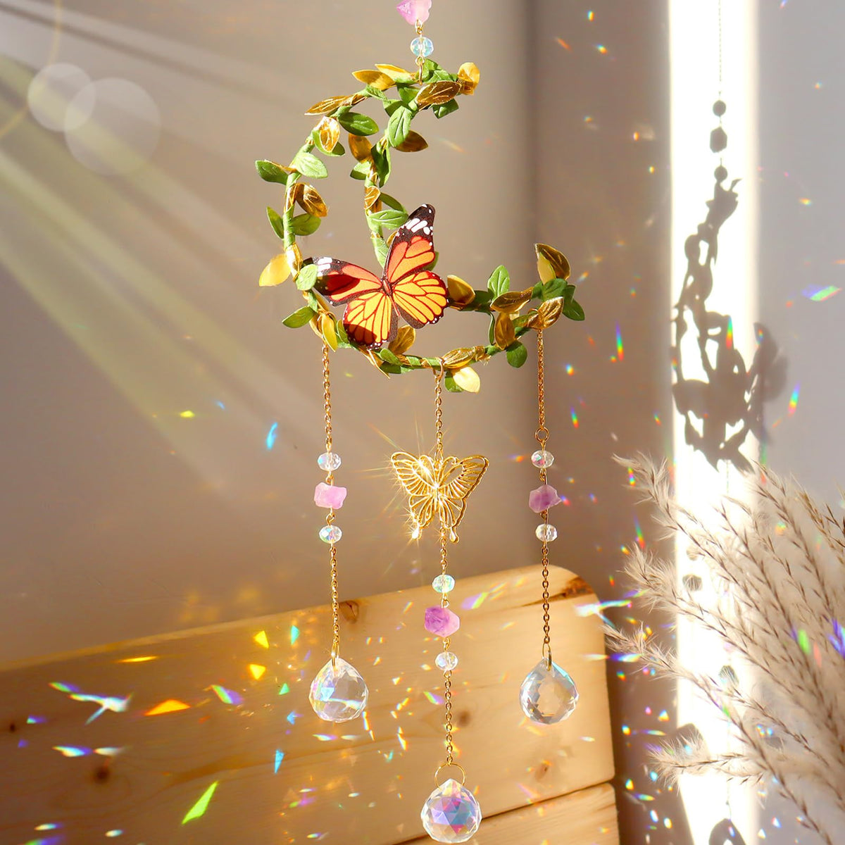 ilclviz Hanging Crystal Suncatcher by Moon casts rainbow light near a sunny window