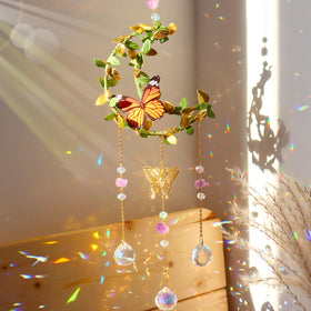 ilclviz Hanging Crystal Suncatcher by Moon casts rainbow light near a sunny window