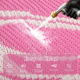 Ileading foldable rug stores compactly in its carrying bag.