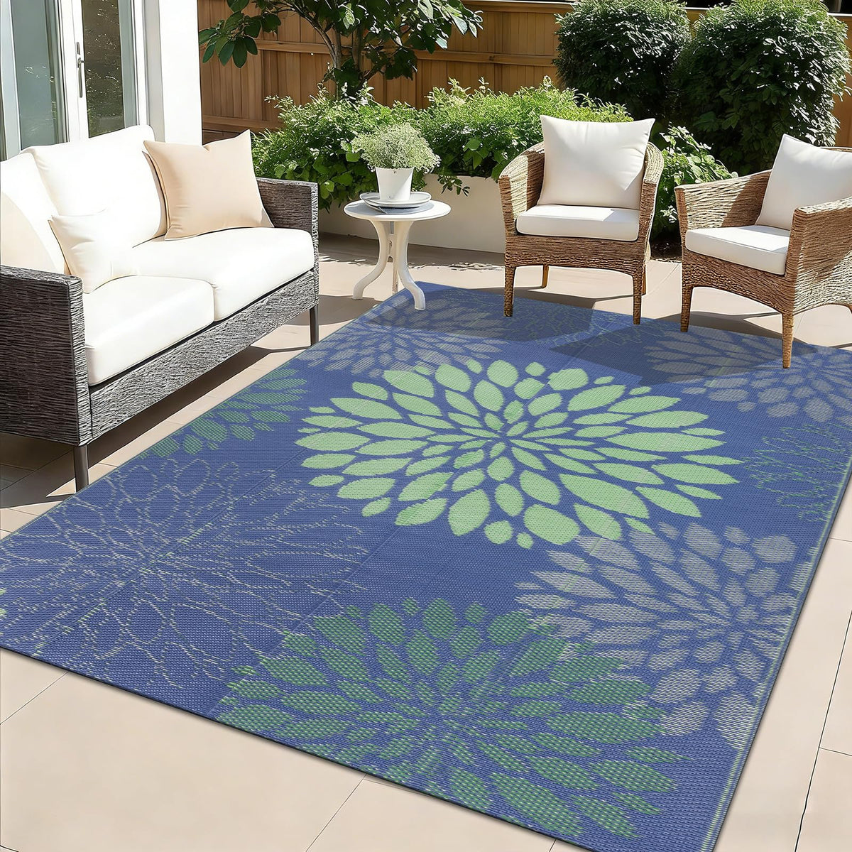 Ileading waterproof outdoor rug in floral navy blue on a deck, durable and weather-ready.