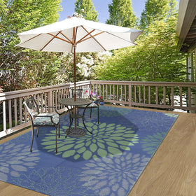 Ileading porch rug cleans easily with hose after outdoor gatherings.