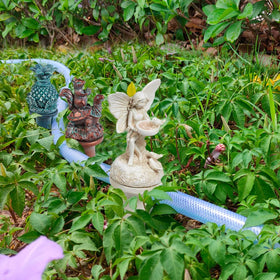 ilitphke fairy hose guide adds whimsy while guiding hoses away from plants
