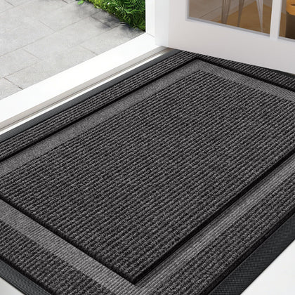 IM HOME large front door mat at outdoor entrance traps dirt and moisture.