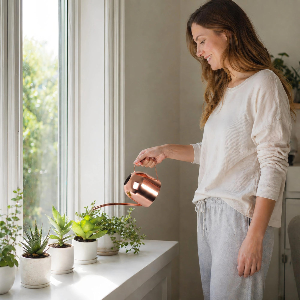 IMEEA watering can in rose gold finish adds style for plant care