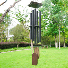 Implication black wind chime outdoor decor enhances garden ambience.