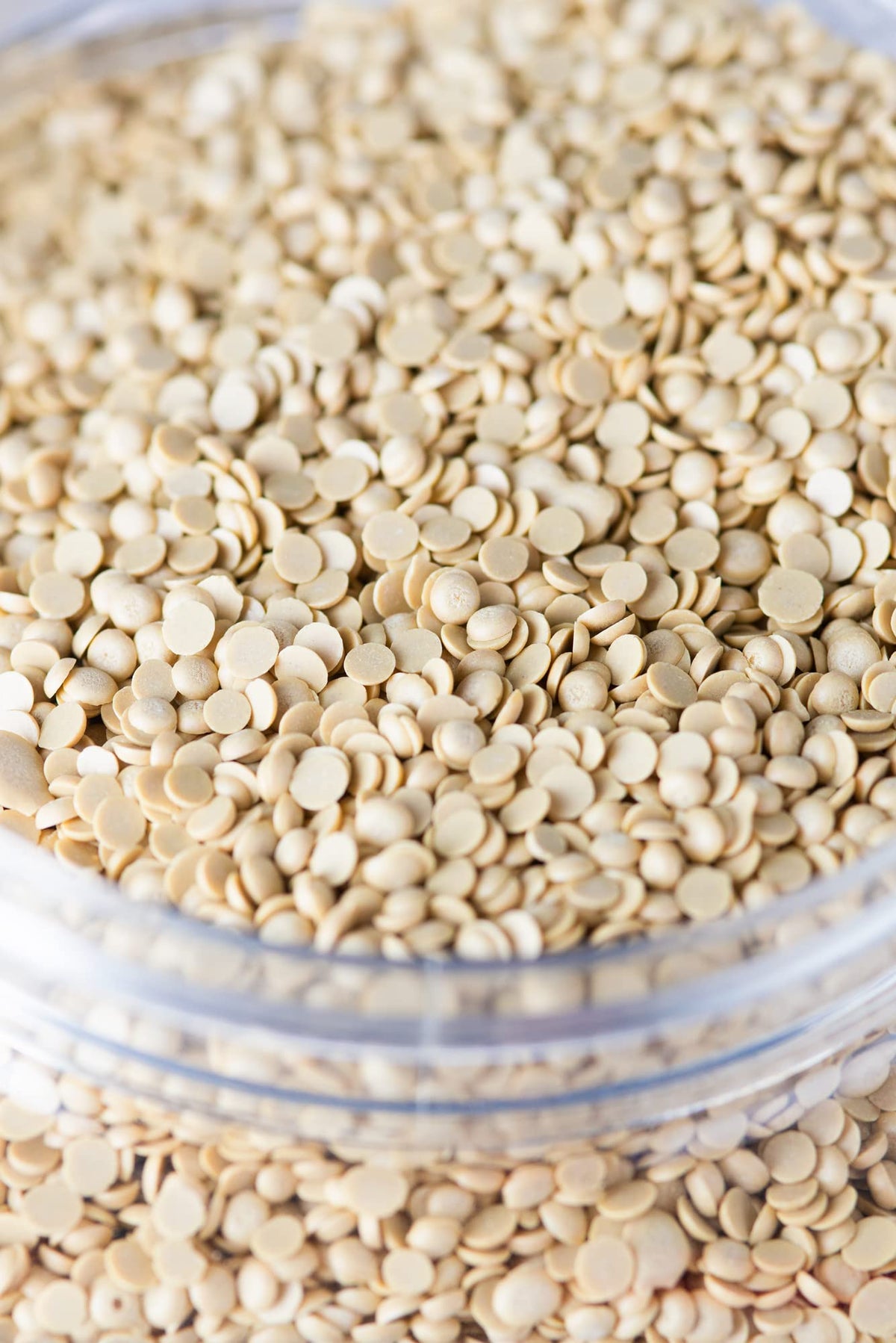 IMUSTGARDEN sulfur pellets close-up reveals granular texture ideal for soil pH balancing.