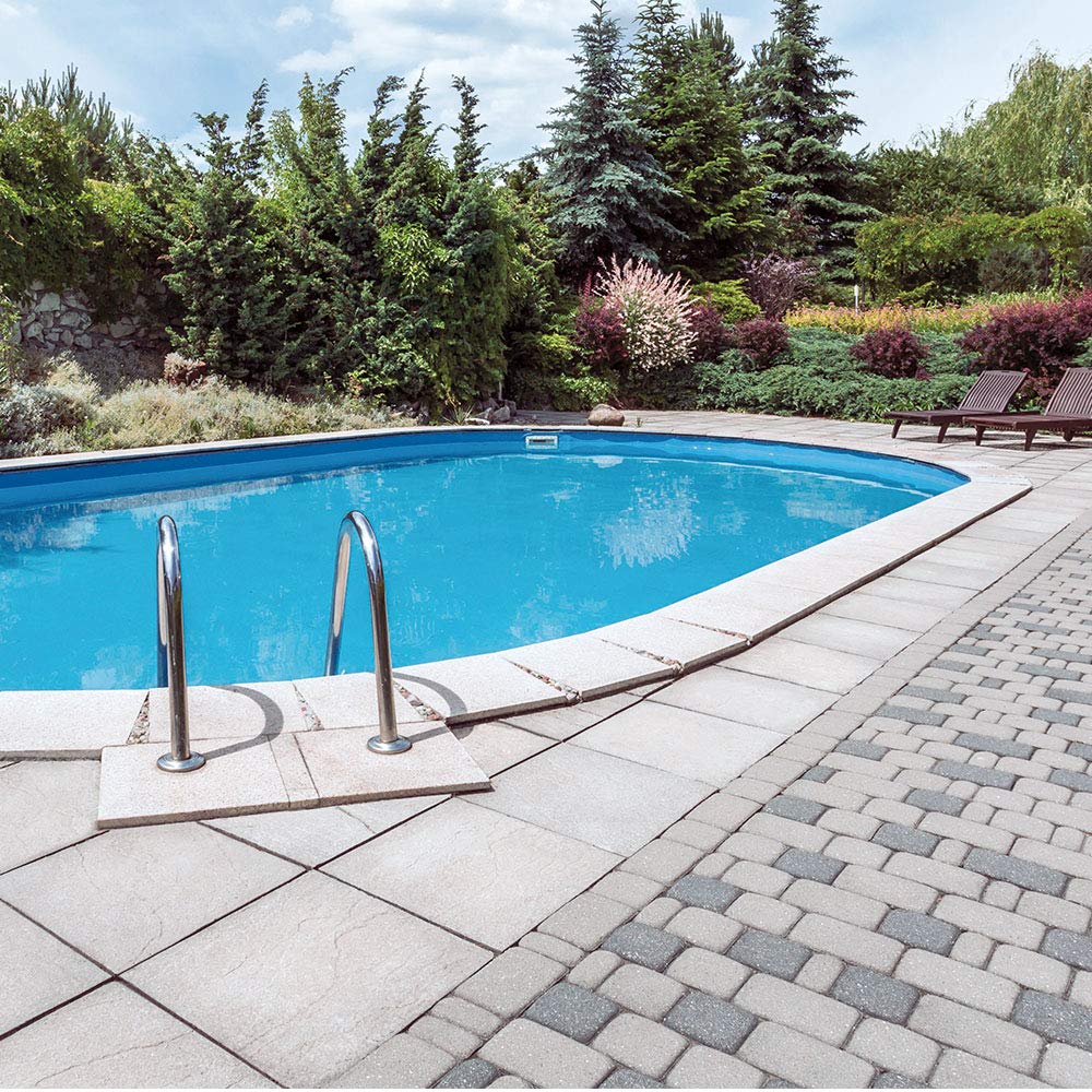Pool coating brush applying INSL-X Waterborne on the wall.