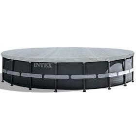 Intex Deluxe pool cover shielding pool from leaves and debris during off-season.