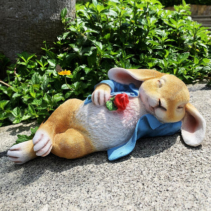 iRonrain garden rabbit blue statue with a rose adds outdoor charm.